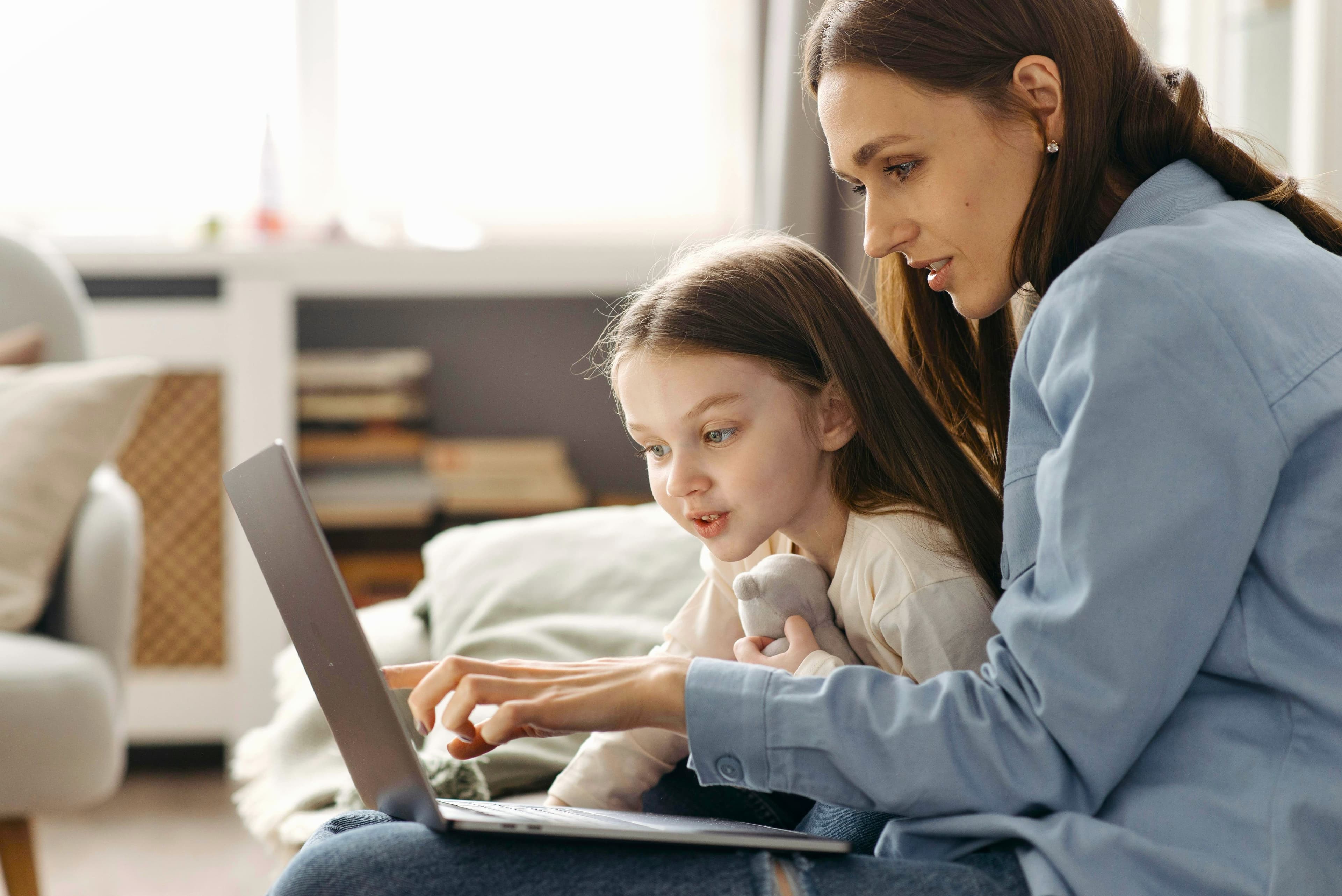Parent and Child interacting with a laptop